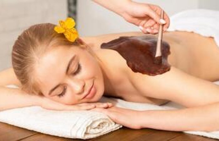 young-woman-take-spa-chocolate-treatments-on-massage-wood-table-photo young-woman-take-spa-chocolate-treatments-on-massage-wood-table-photo